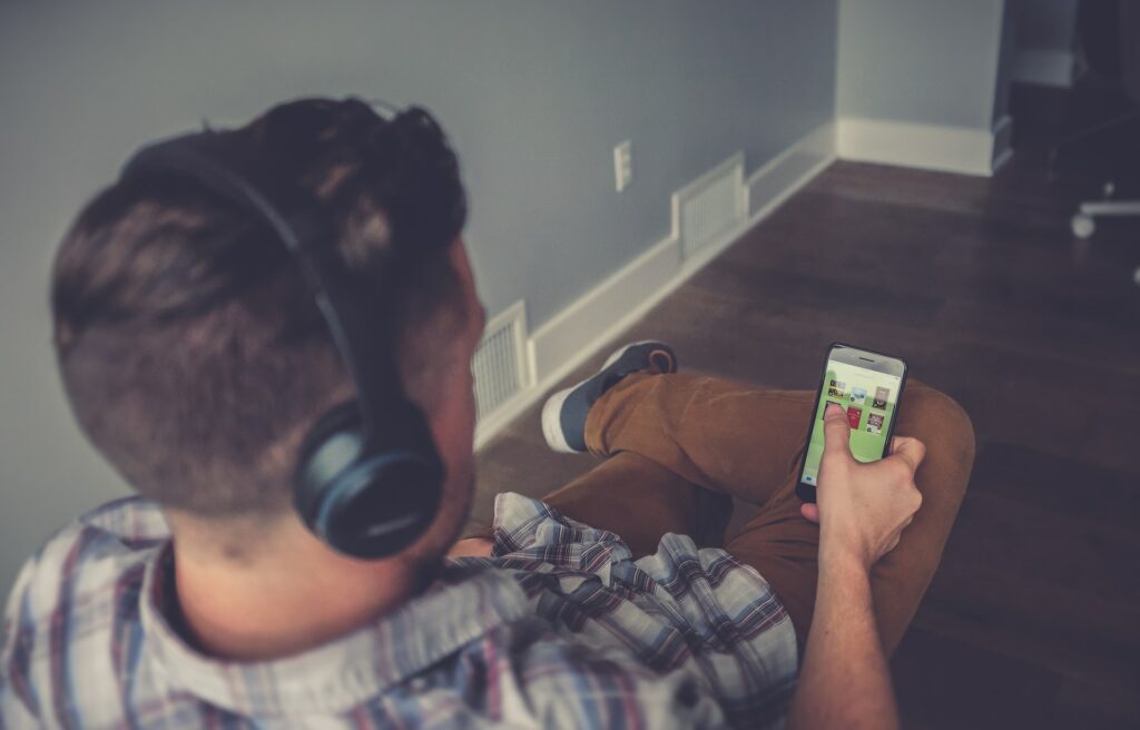 man scrolling phone