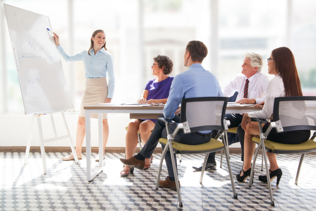 a lady presenting in a office meeting